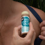 Anti Chafe Balm being applied to a shoulder
