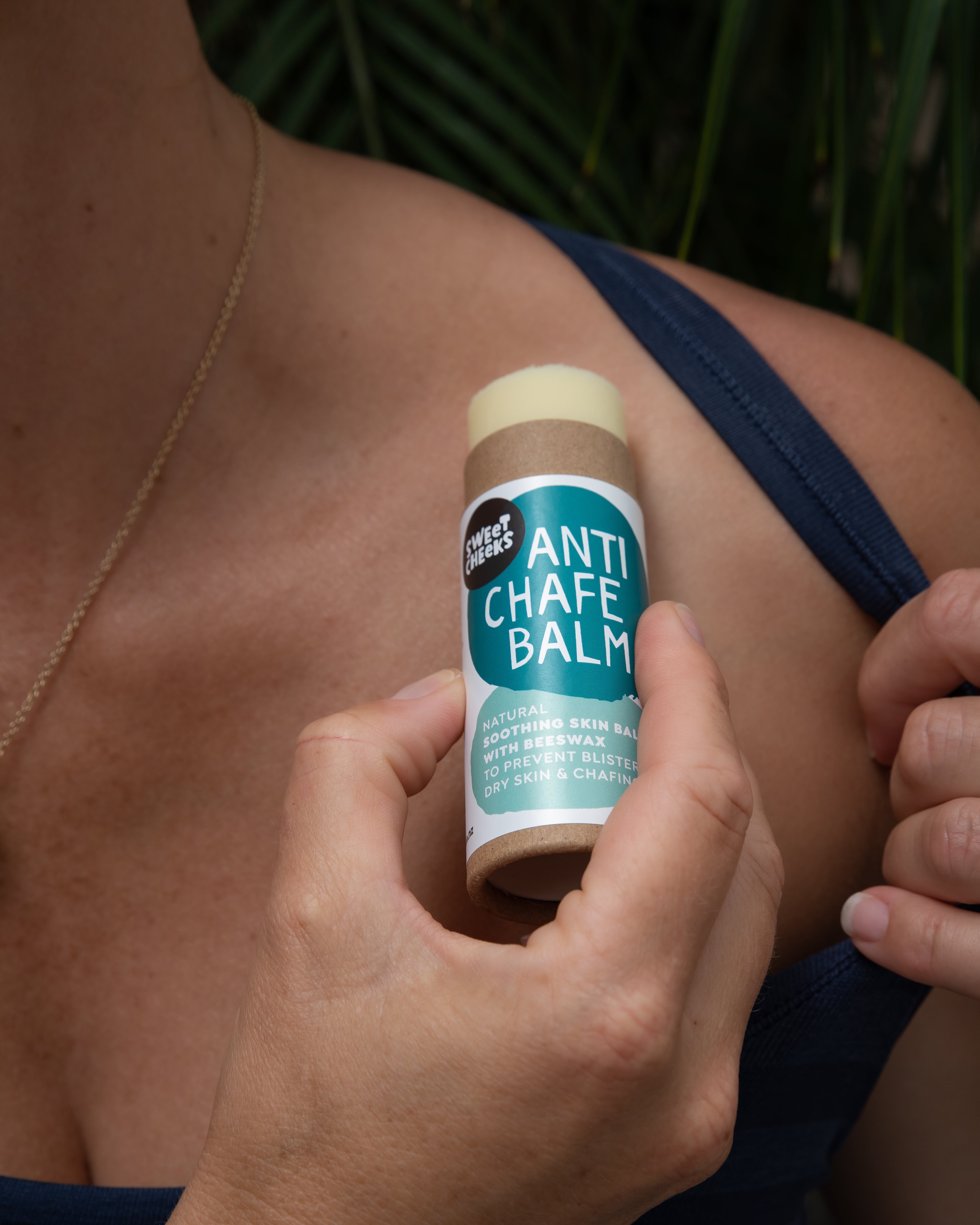 Anti Chafe Balm being applied to a shoulder