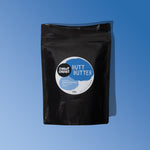 Butt Butter black bag with blue background
